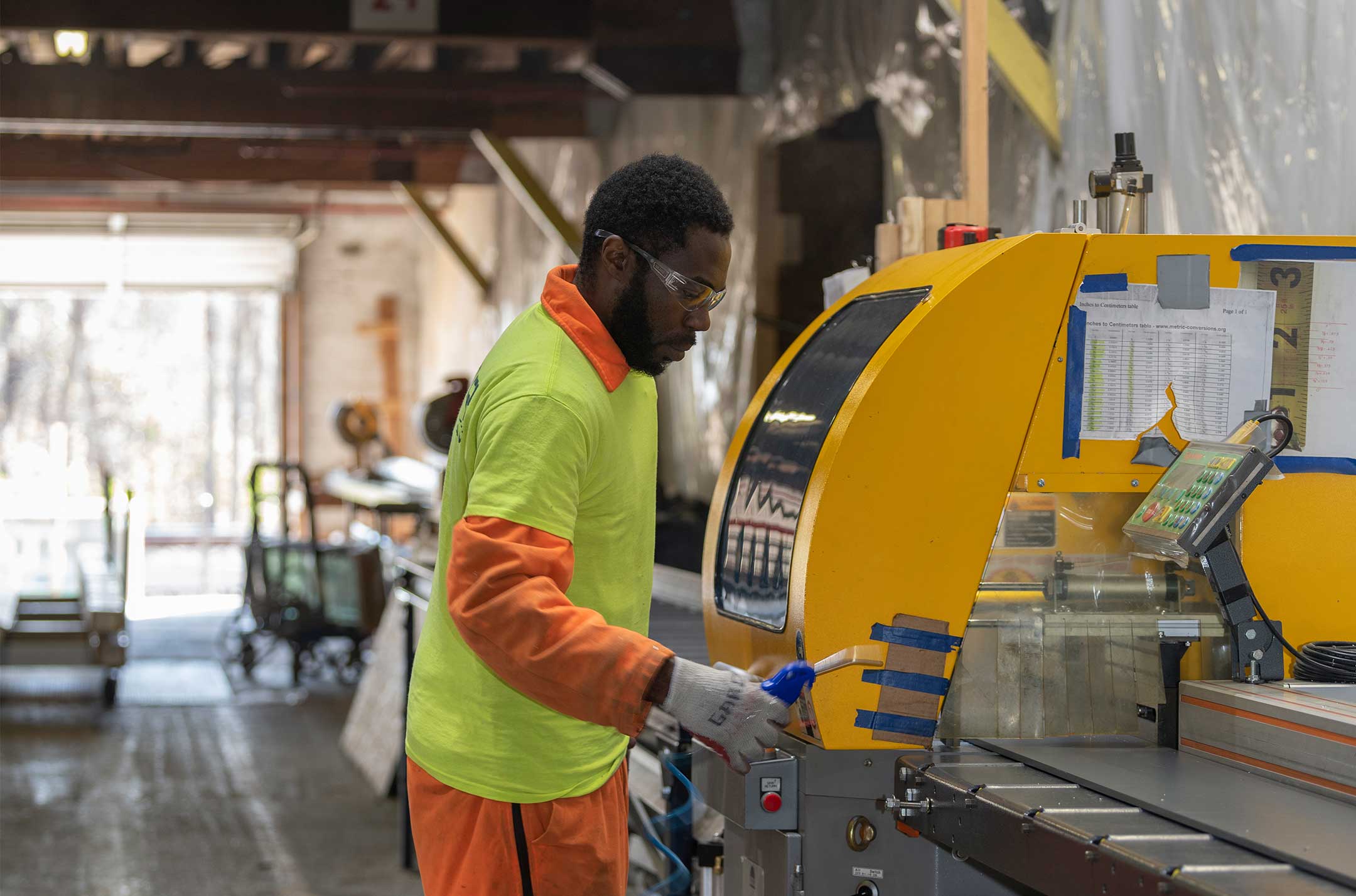 Technician using equipment in workshop