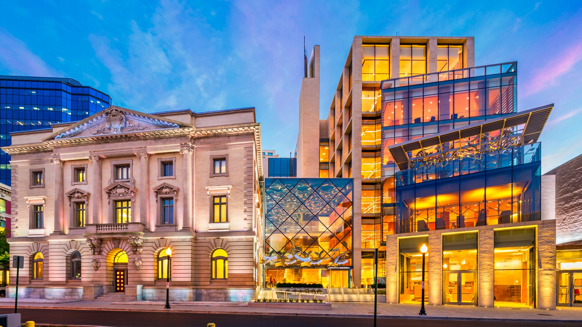 Historic and modern buildings at dusk